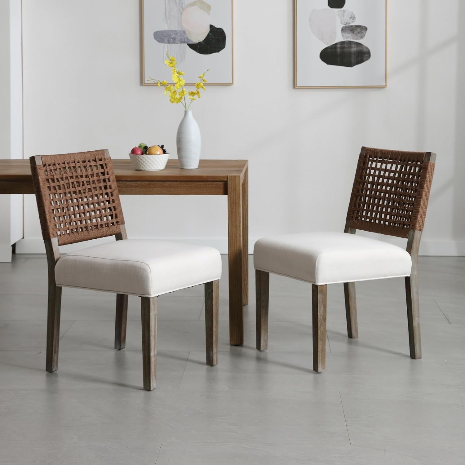 Dining table with two chairs in a modern interior setting