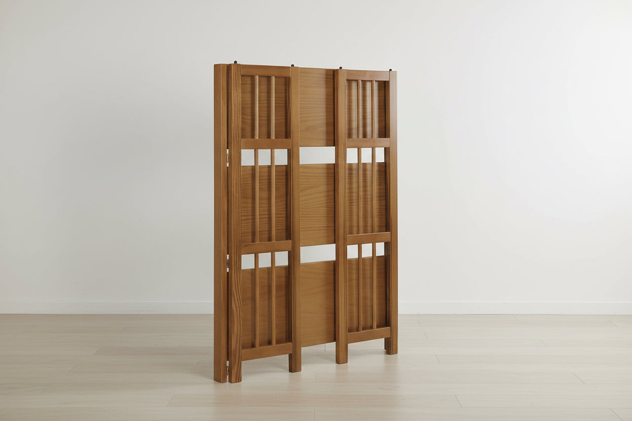 Wooden screen with lattice design on a white background