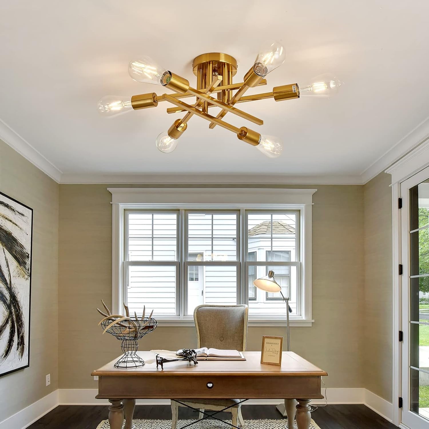 Gold ceiling light fixture in a home office setting