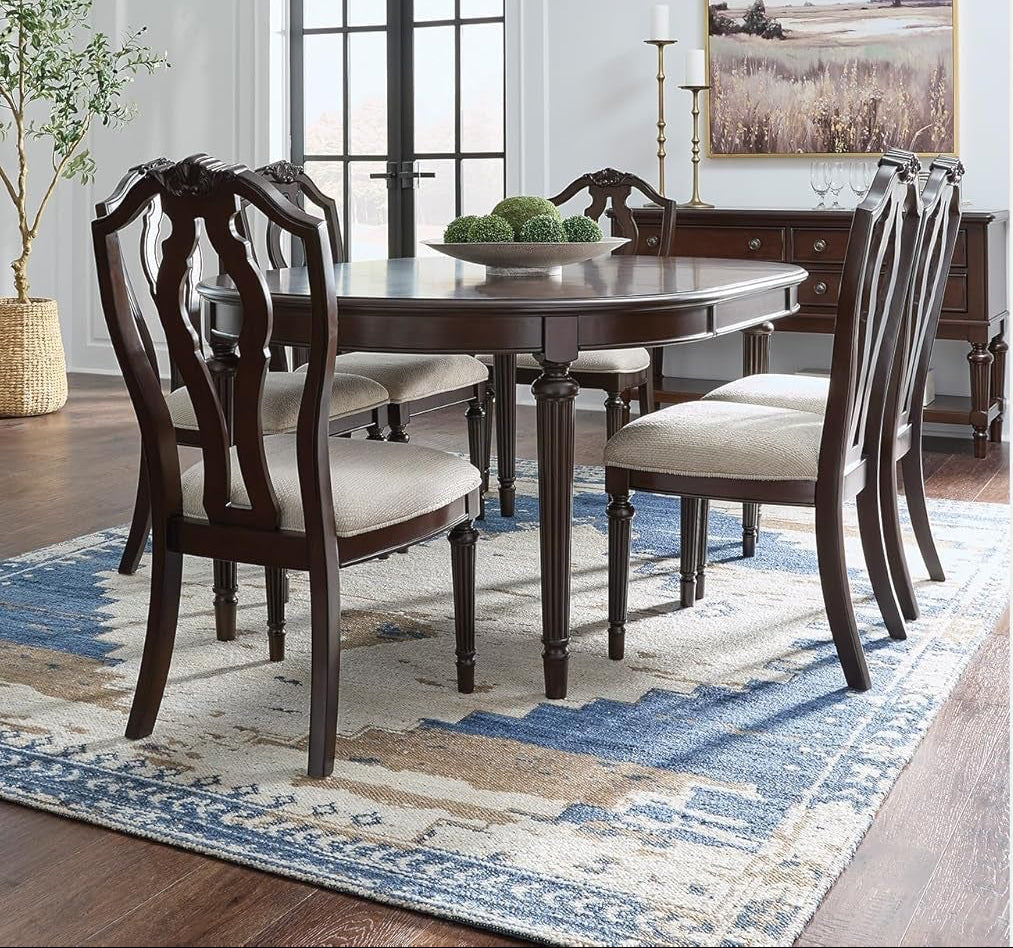 Dining room with wooden table and chairs, featuring text about the dining chair's design.