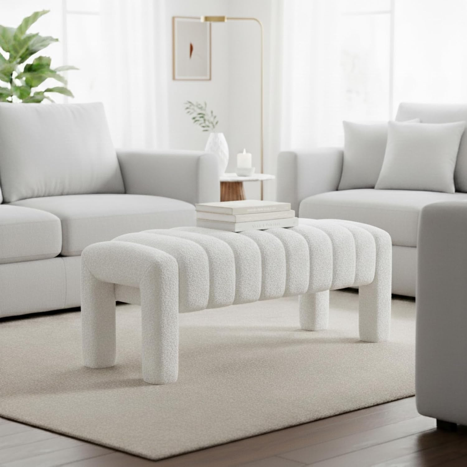 Modern living room with light gray sectional sofa, coffee table, and decorative elements.