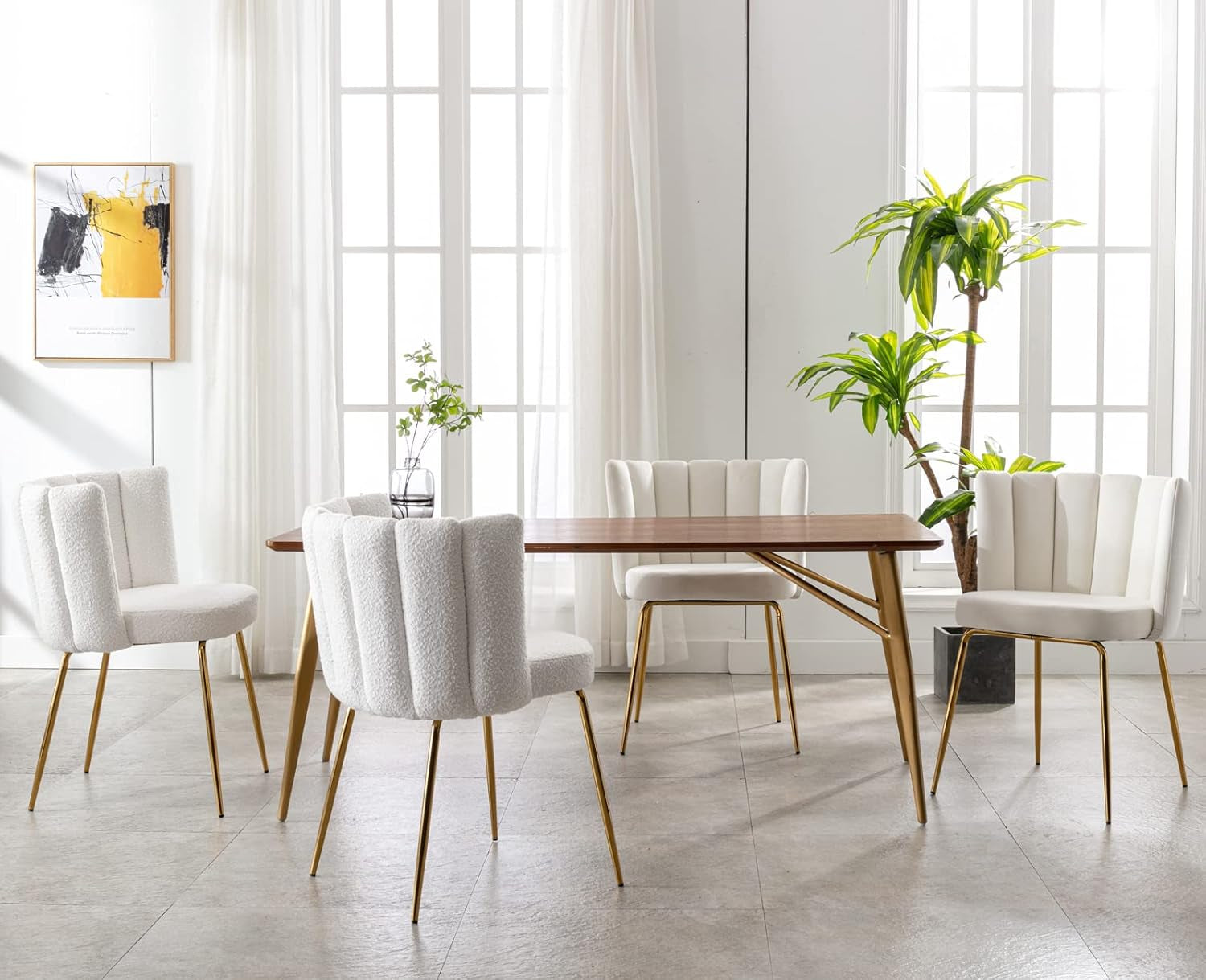 Dining room with a wooden table and white chairs in a bright room with large windows.