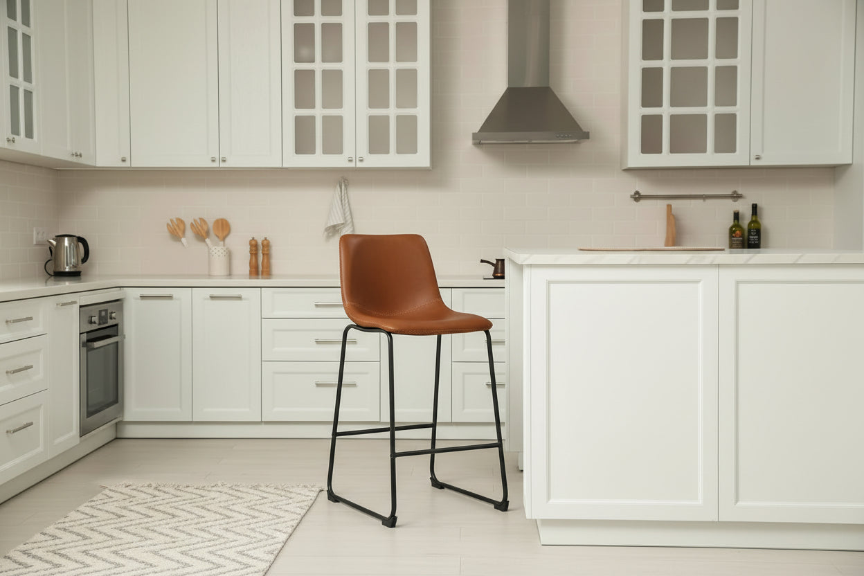 Man sitting on a stool in a modern kitchen