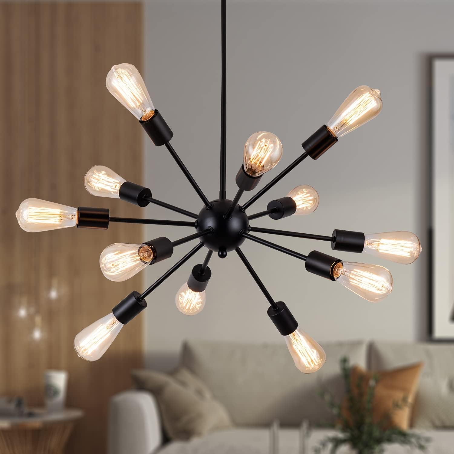Modern chandelier with multiple light bulbs in a living room setting