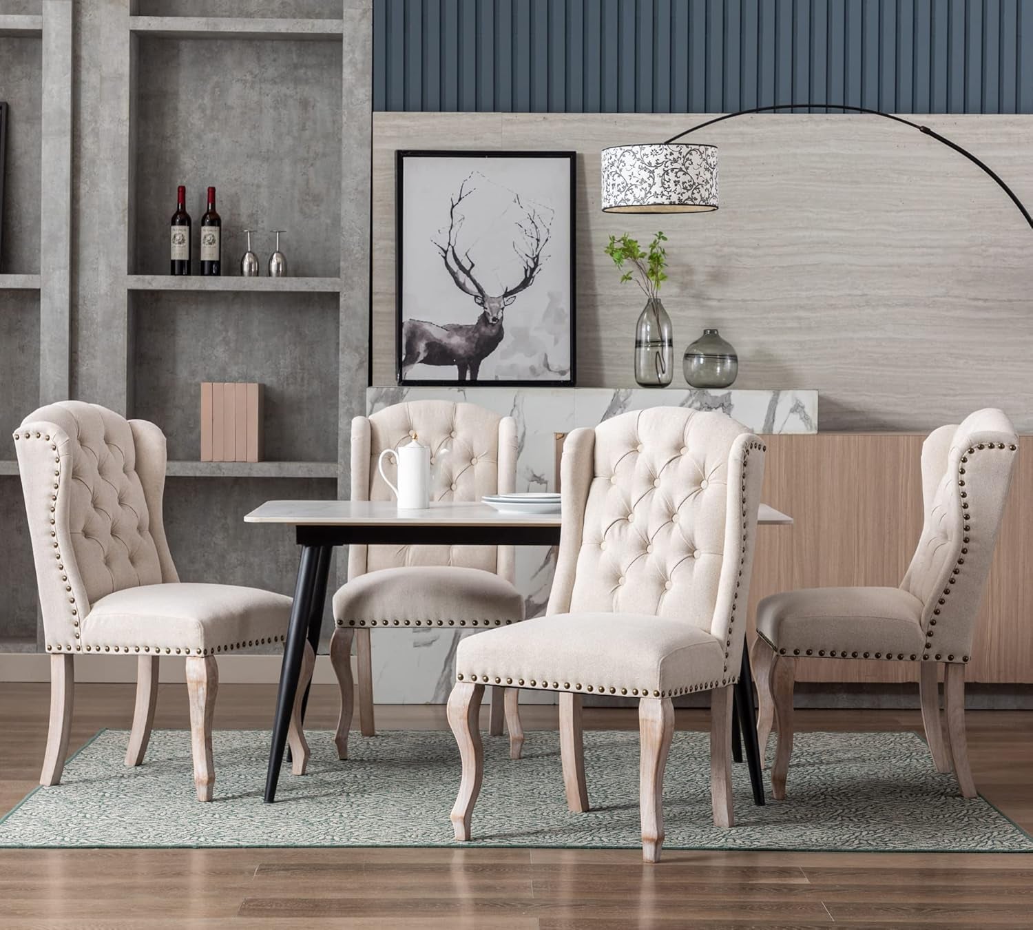 Dining room with upholstered chairs, a table, and decorative elements.