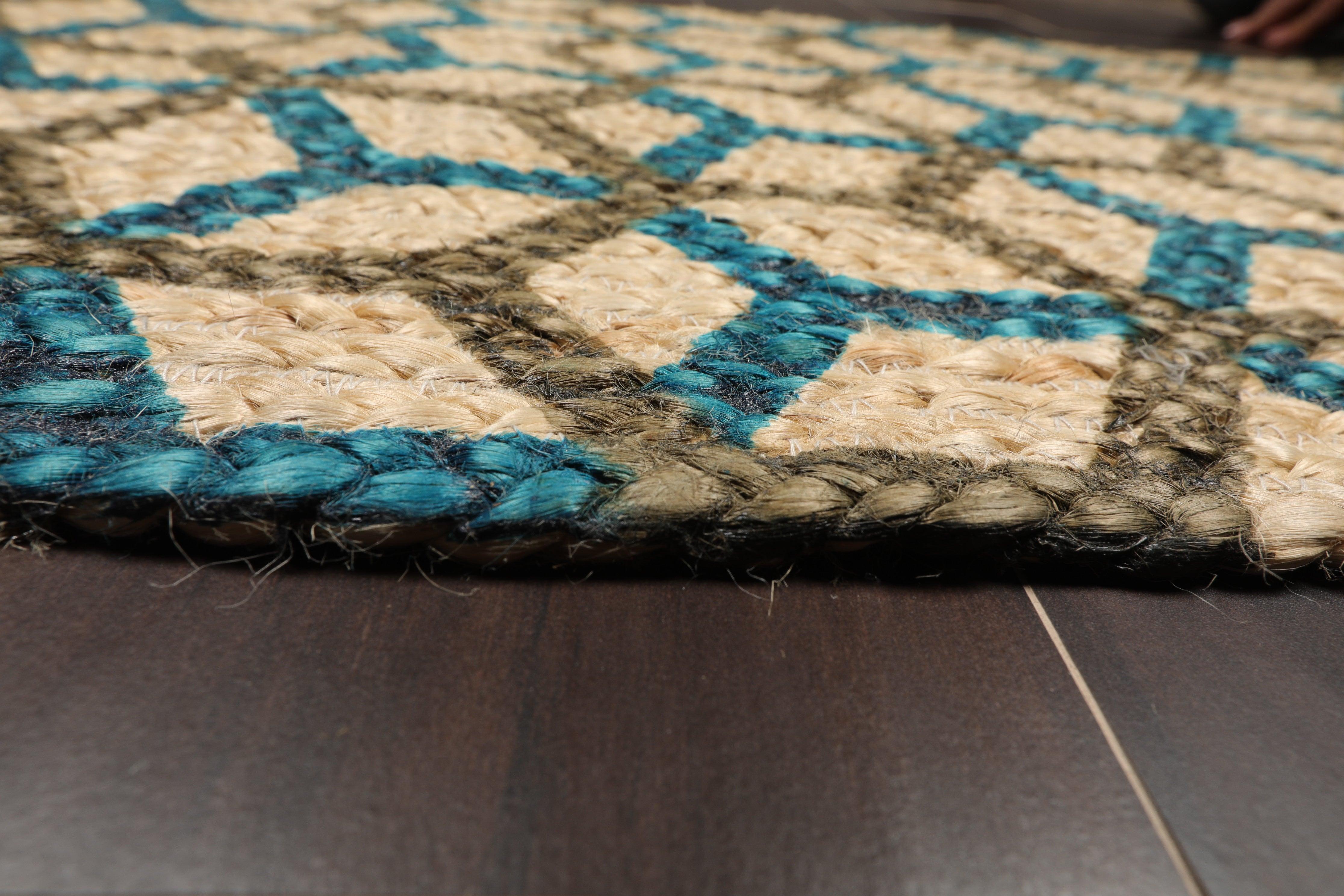 Close-up of a textured rug with geometric pattern on a wooden floor.