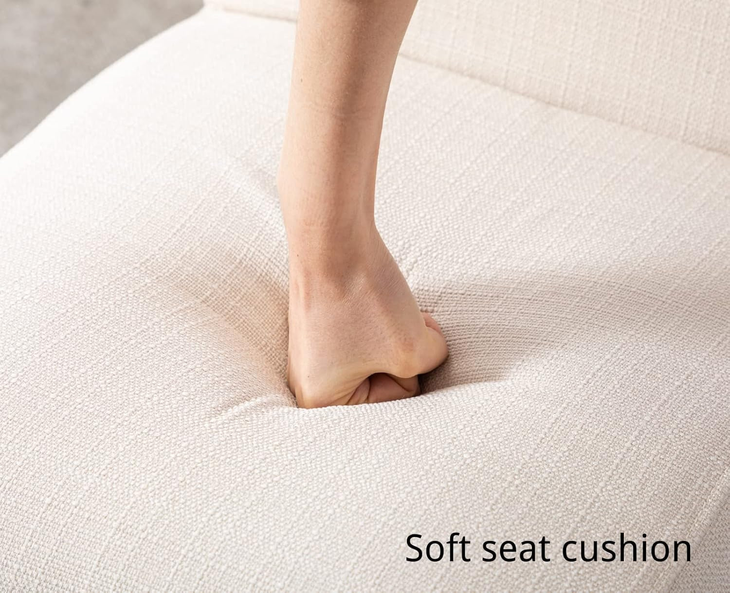 Person stepping onto a soft seat cushion with a neutral background
