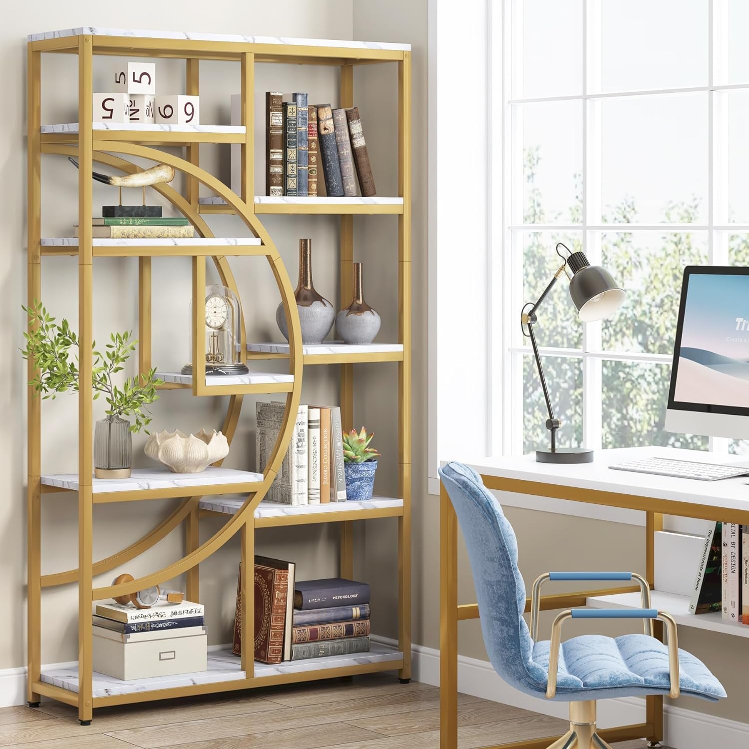 Gold circular bookshelf in a home office setting with books, decor items, and a desk.