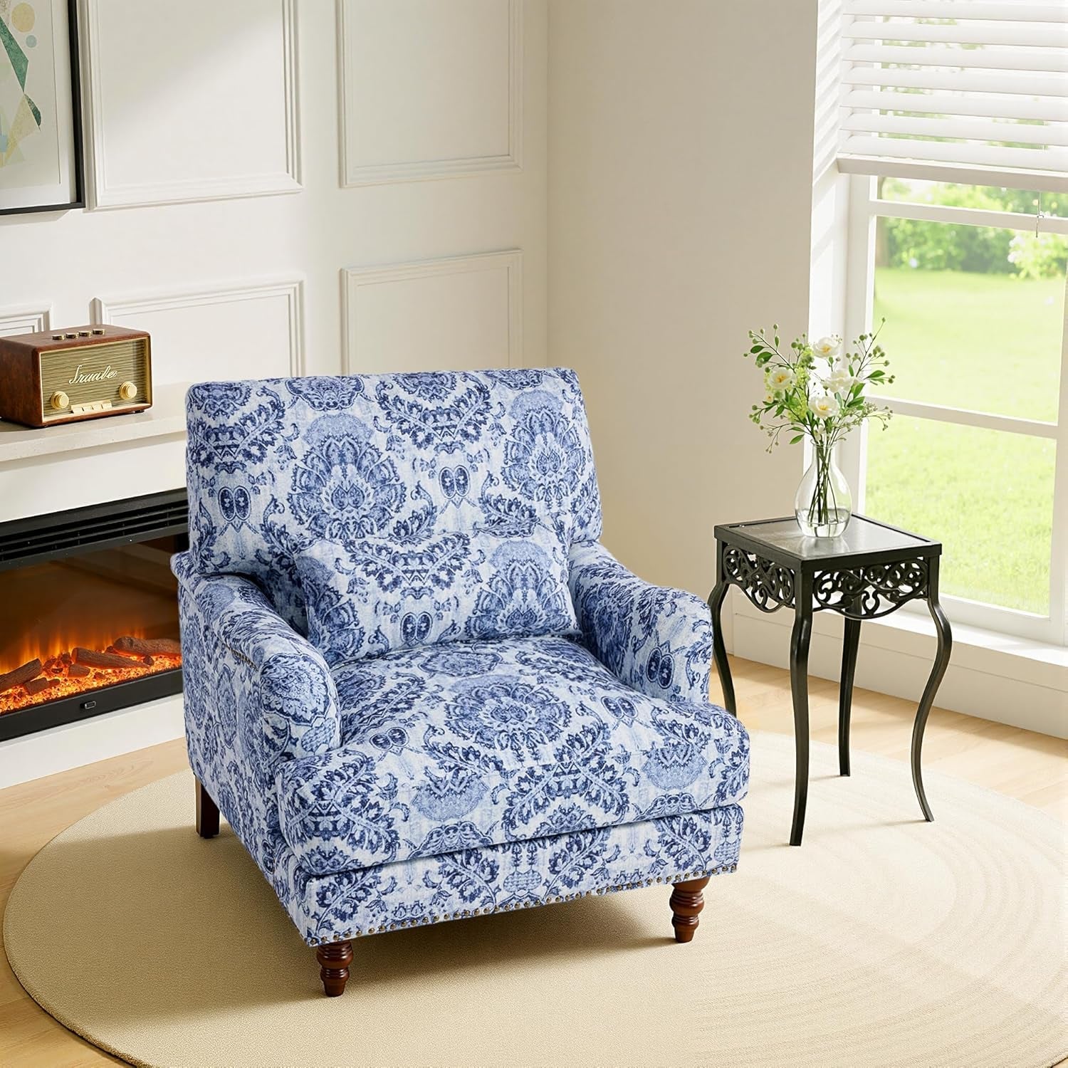 Blue patterned armchair in a living room with a fireplace and window.