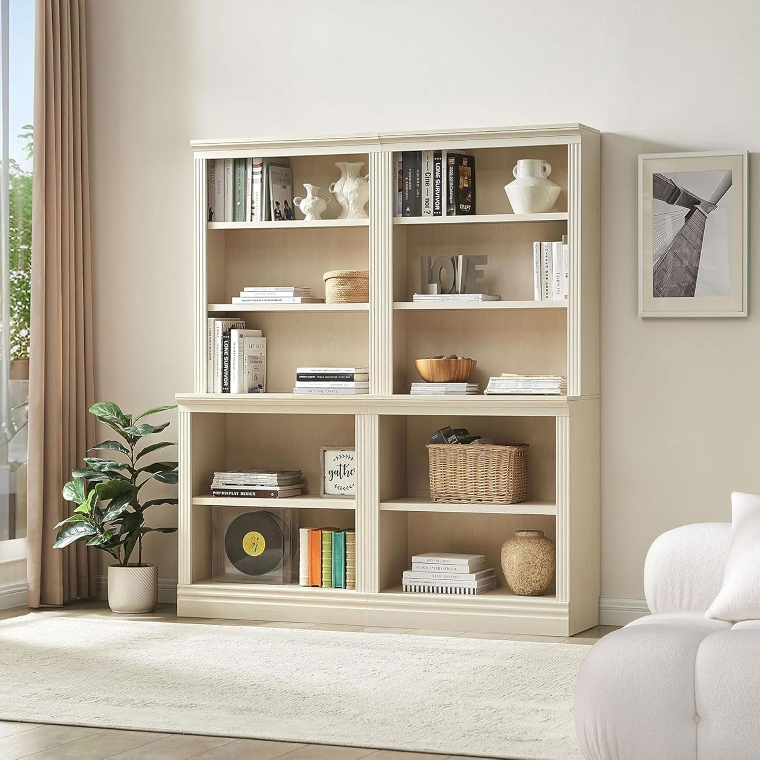Beige bookshelf with decorative items in a living room setting