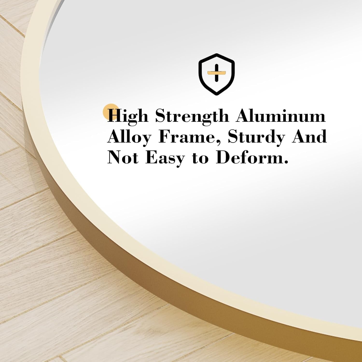 Round mirror with gold frame on a light wooden surface, featuring text about high strength aluminum alloy frame.