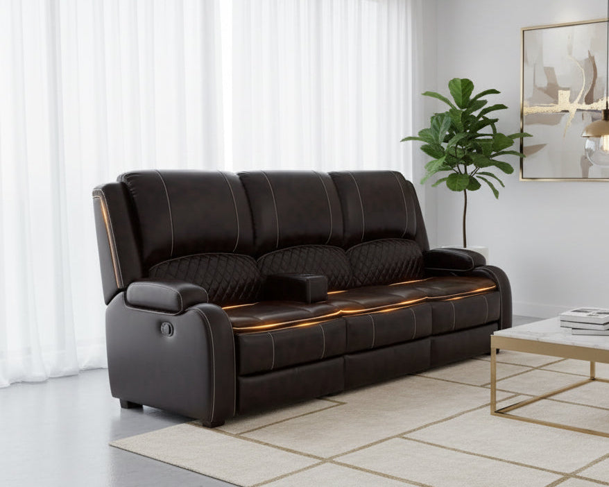 Brown leather sofa with quilted armrests on a dark background