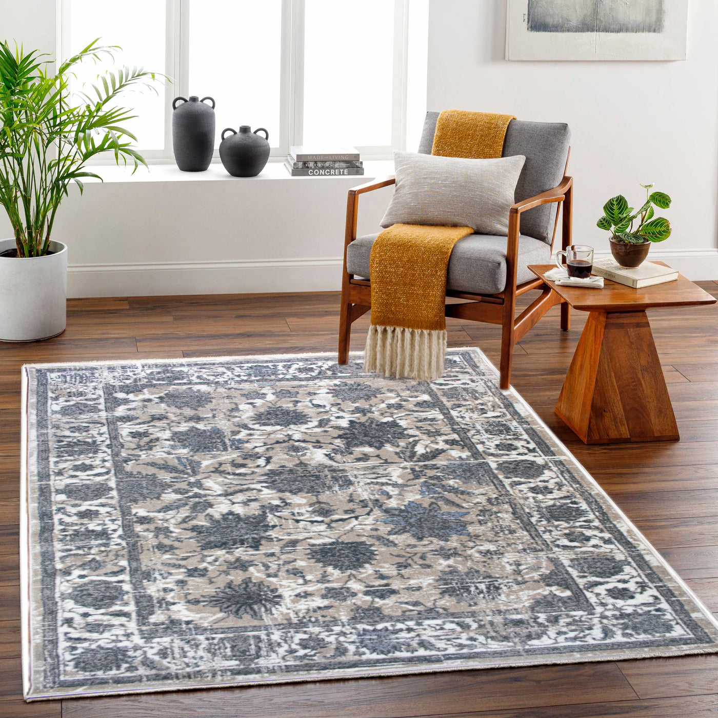 Living room with a patterned rug, wooden chair, and coffee table.