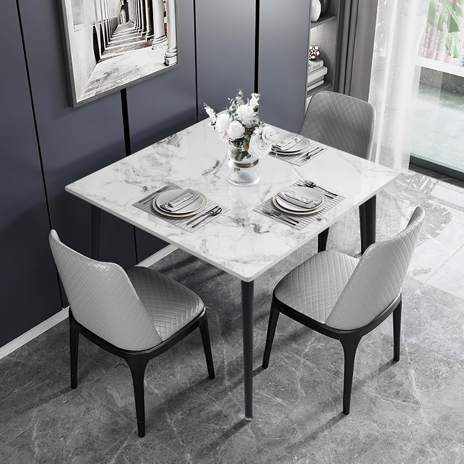 Dining table set with marble-like surface and chairs in a modern room.