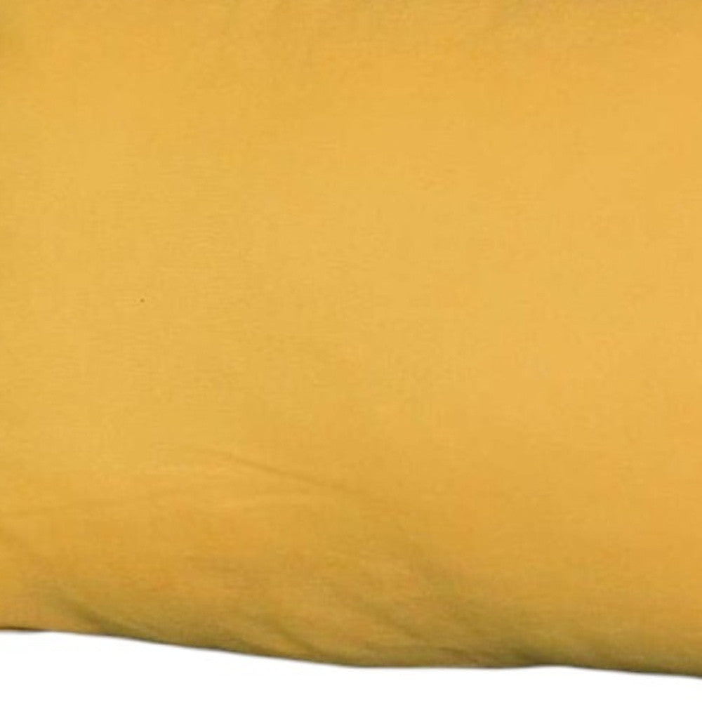 Close-up of a mustard yellow fabric texture