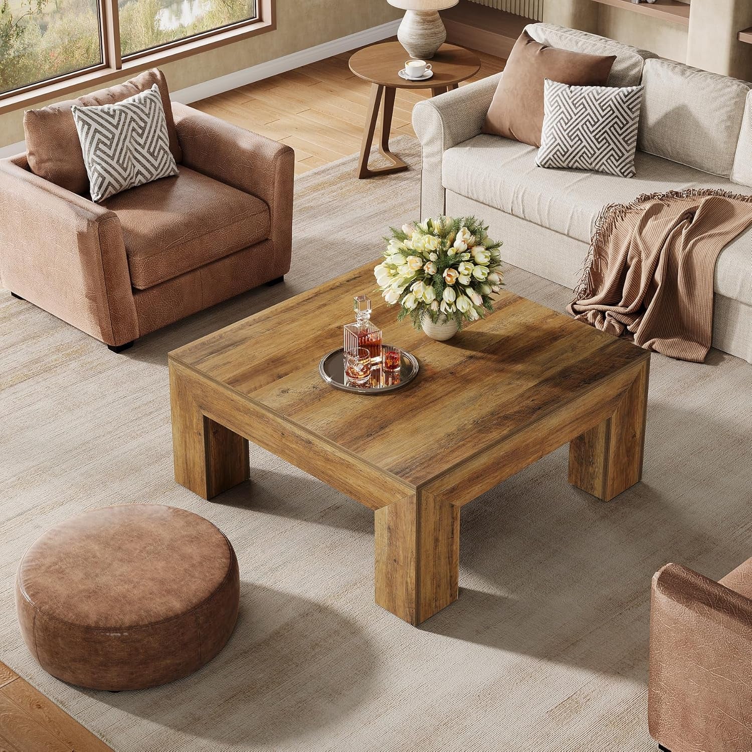 Living room with wooden coffee table, armchair, and sofa.