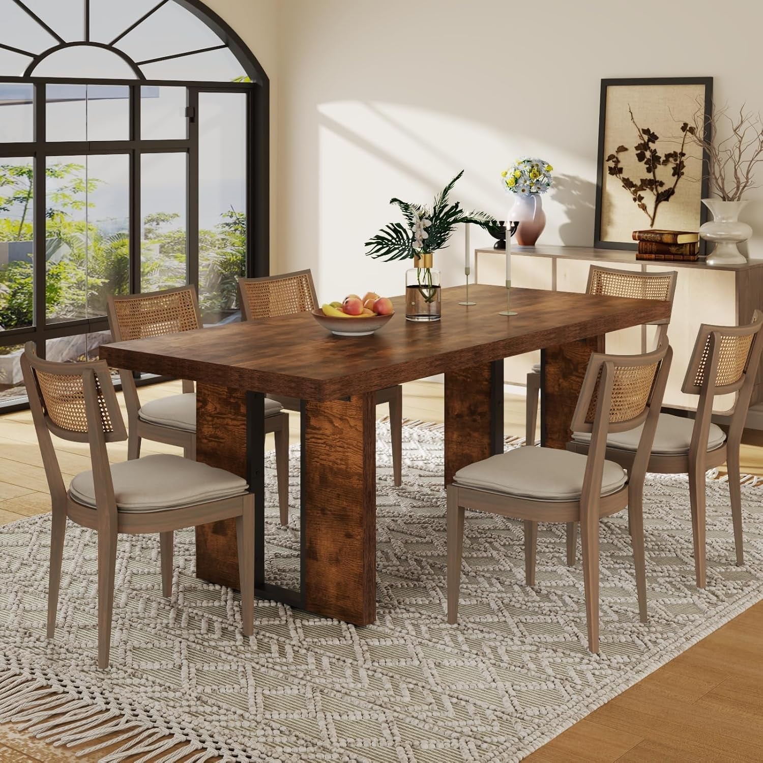 Dining room with wooden table and chairs in a well-lit room.