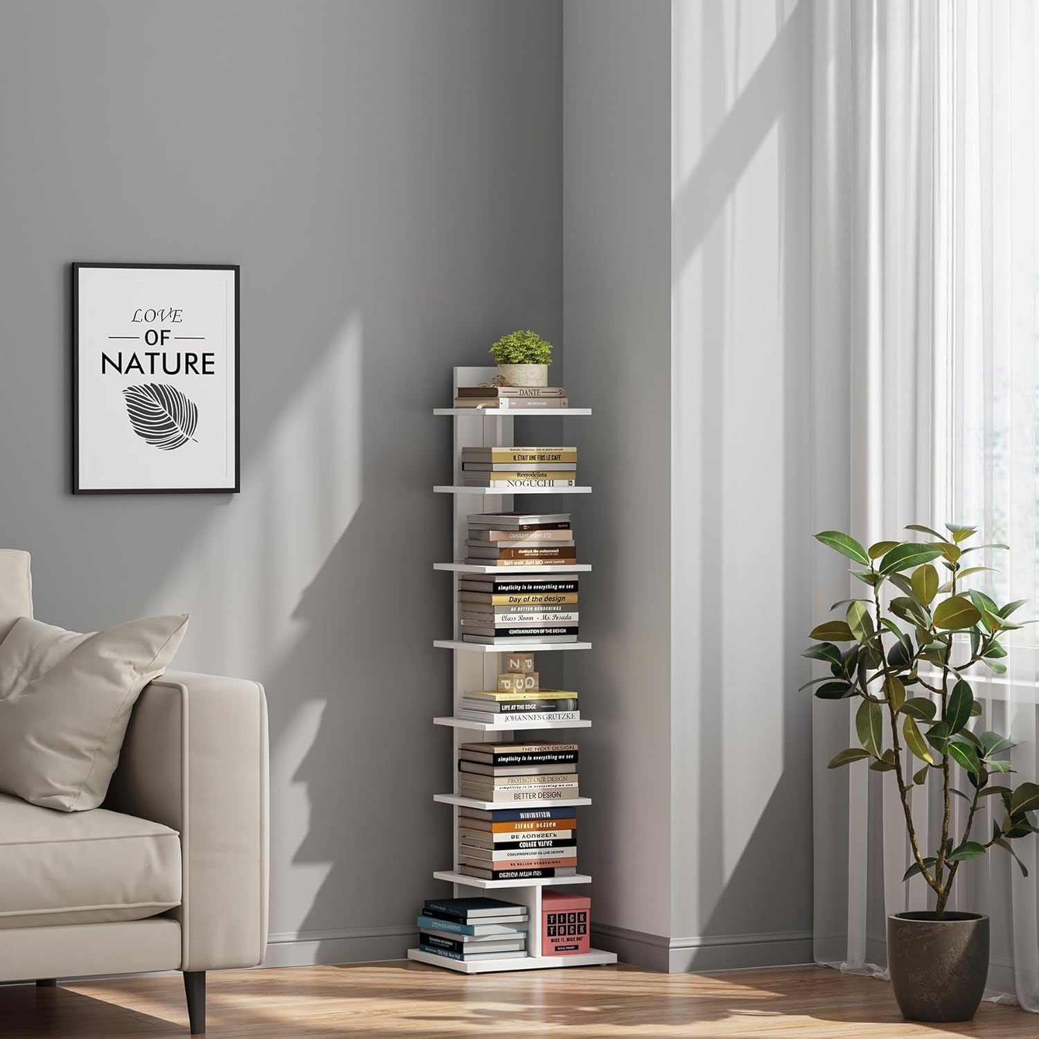 Tall white bookshelf against a gray wall with books and plants, next to a beige armchair and a framed picture.