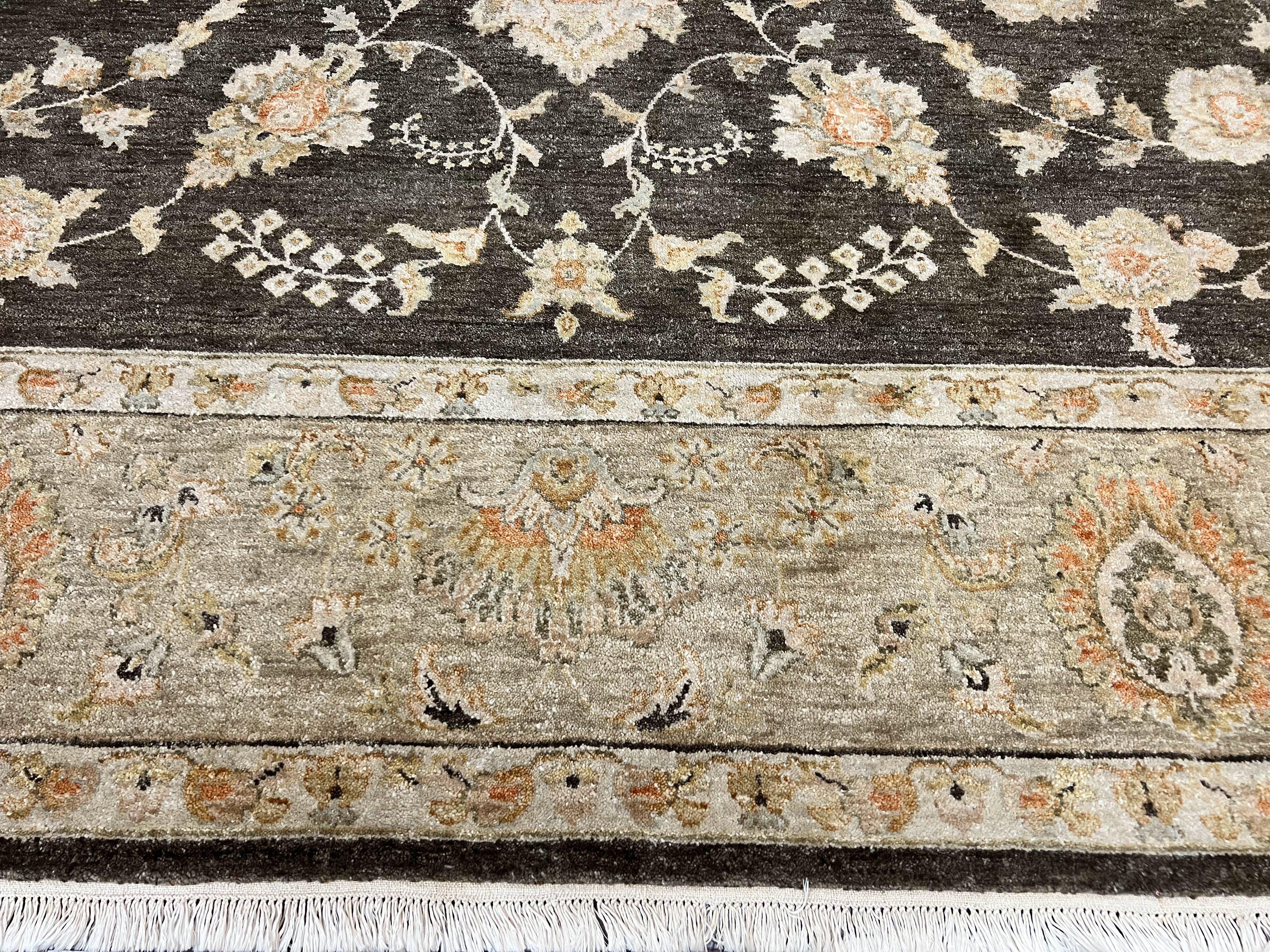 Decorative floral-patterned rug with a dark brown border on a white background