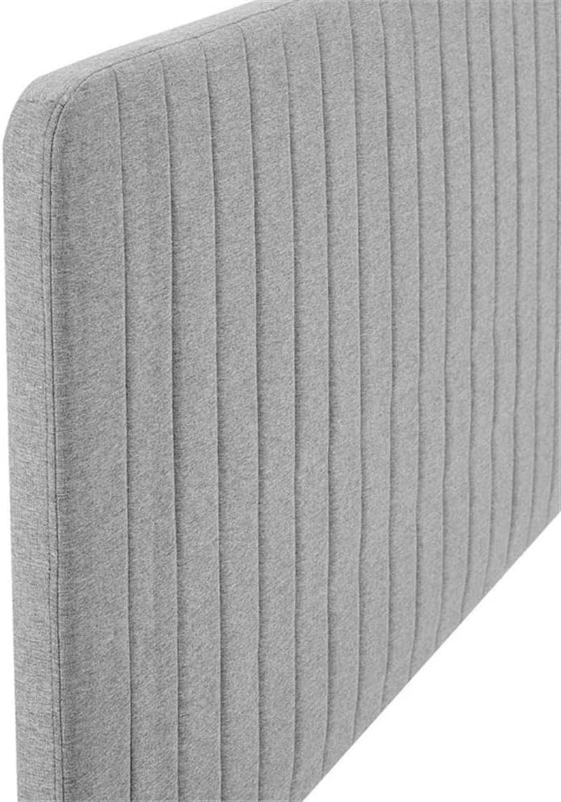 Gray upholstered headboard with a ribbed texture on a white background