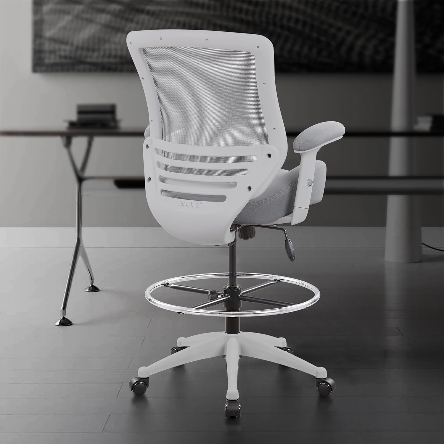 White office chair in a modern office setting with blurred background