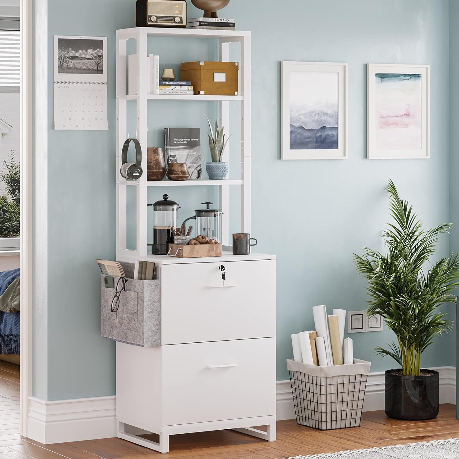 White storage cabinet with shelves and drawers in a room with light blue walls, framed pictures, and plants.