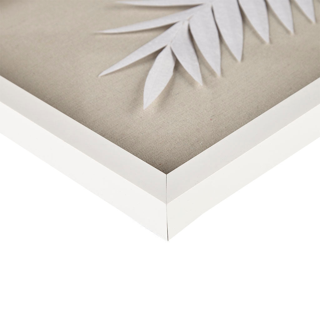 Framed artwork with a neutral background and white leaves