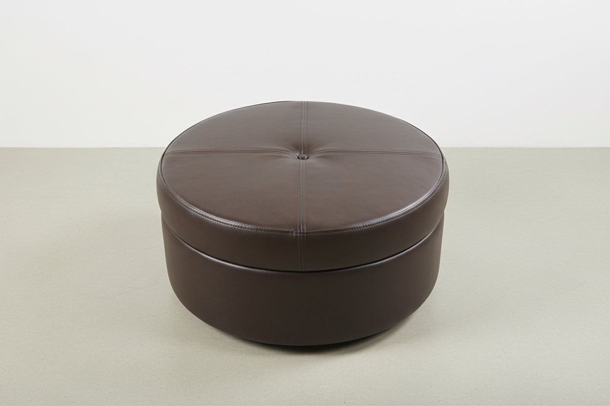Round brown leather ottoman on a white background