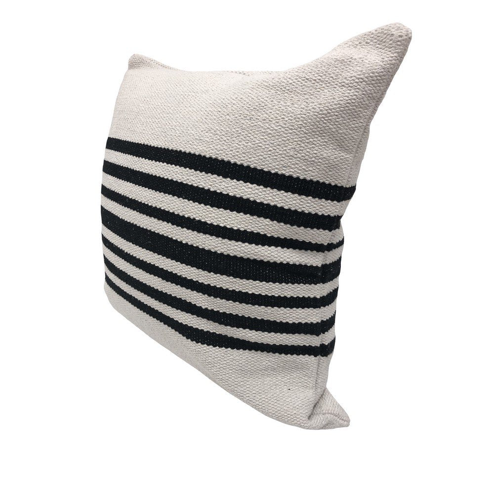 Striped pillow with black and white stripes on a white background