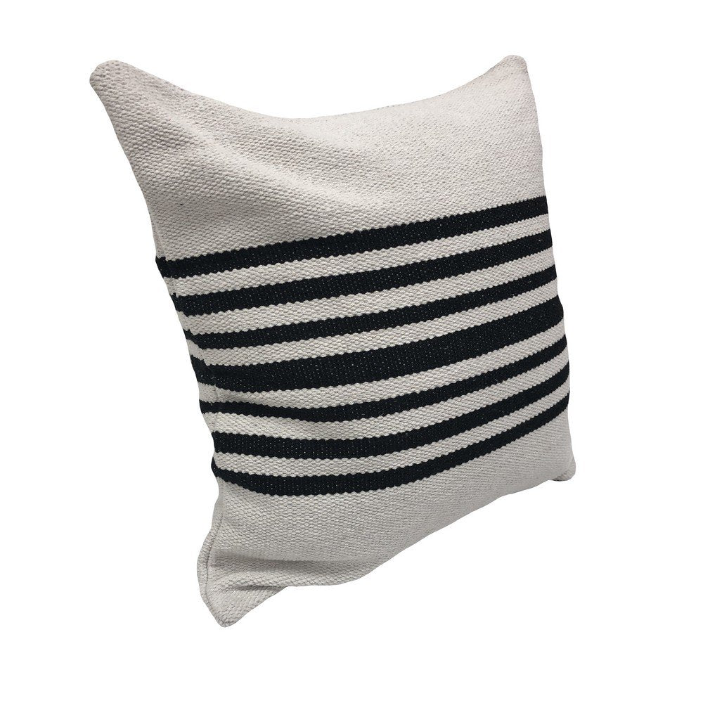 Striped pillow with black and white pattern on a white background