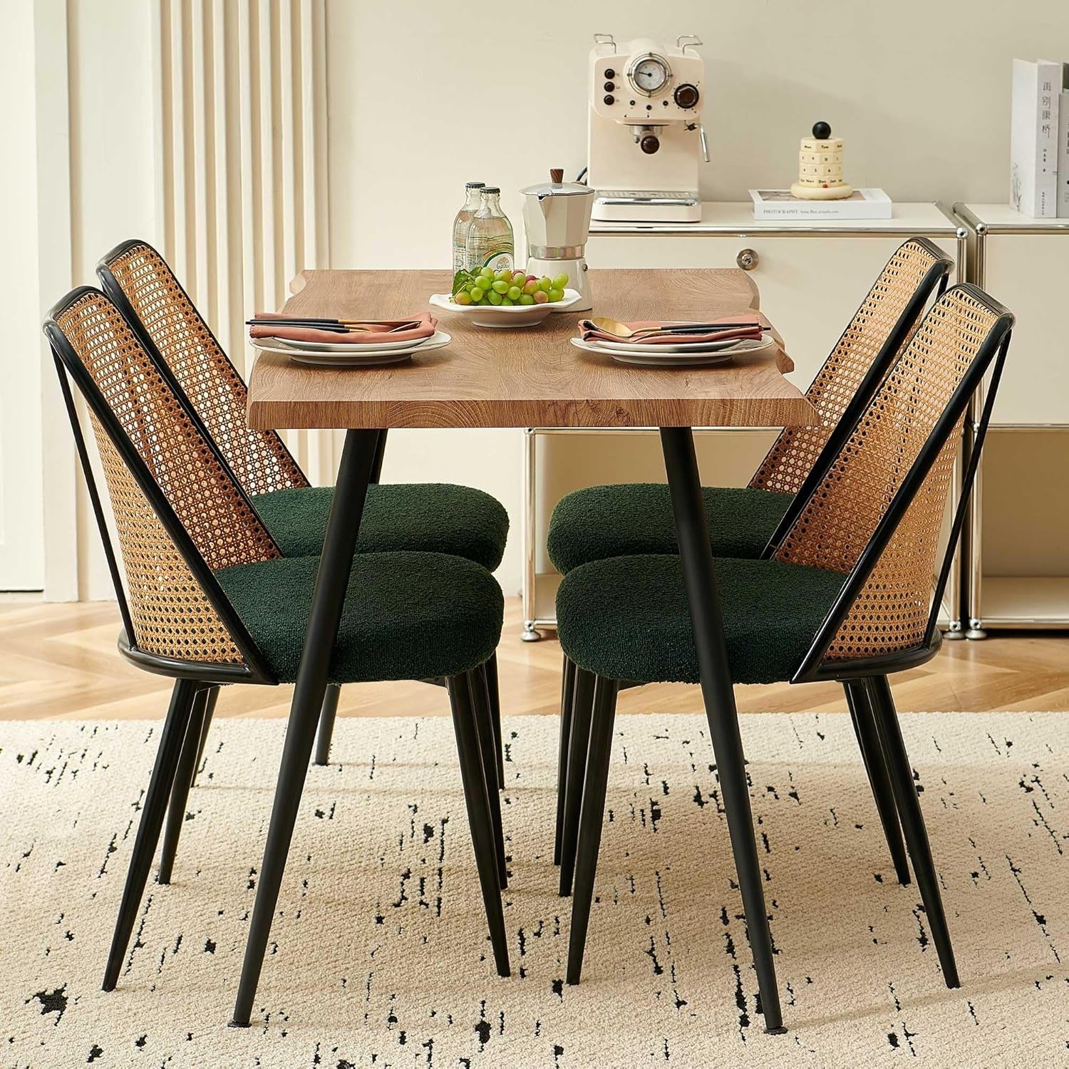 Dining table with four chairs in a room setting