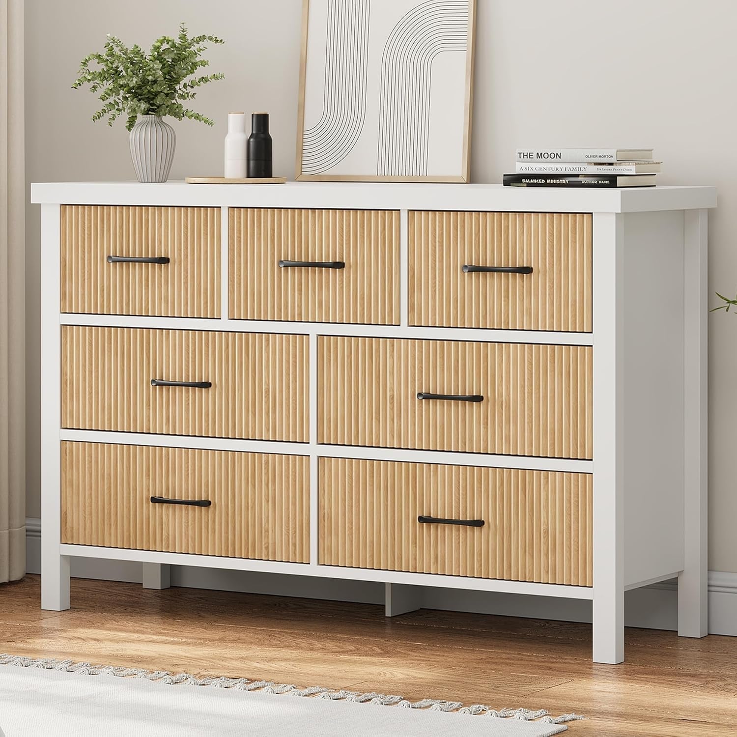 White dresser with wooden drawers in a room setting