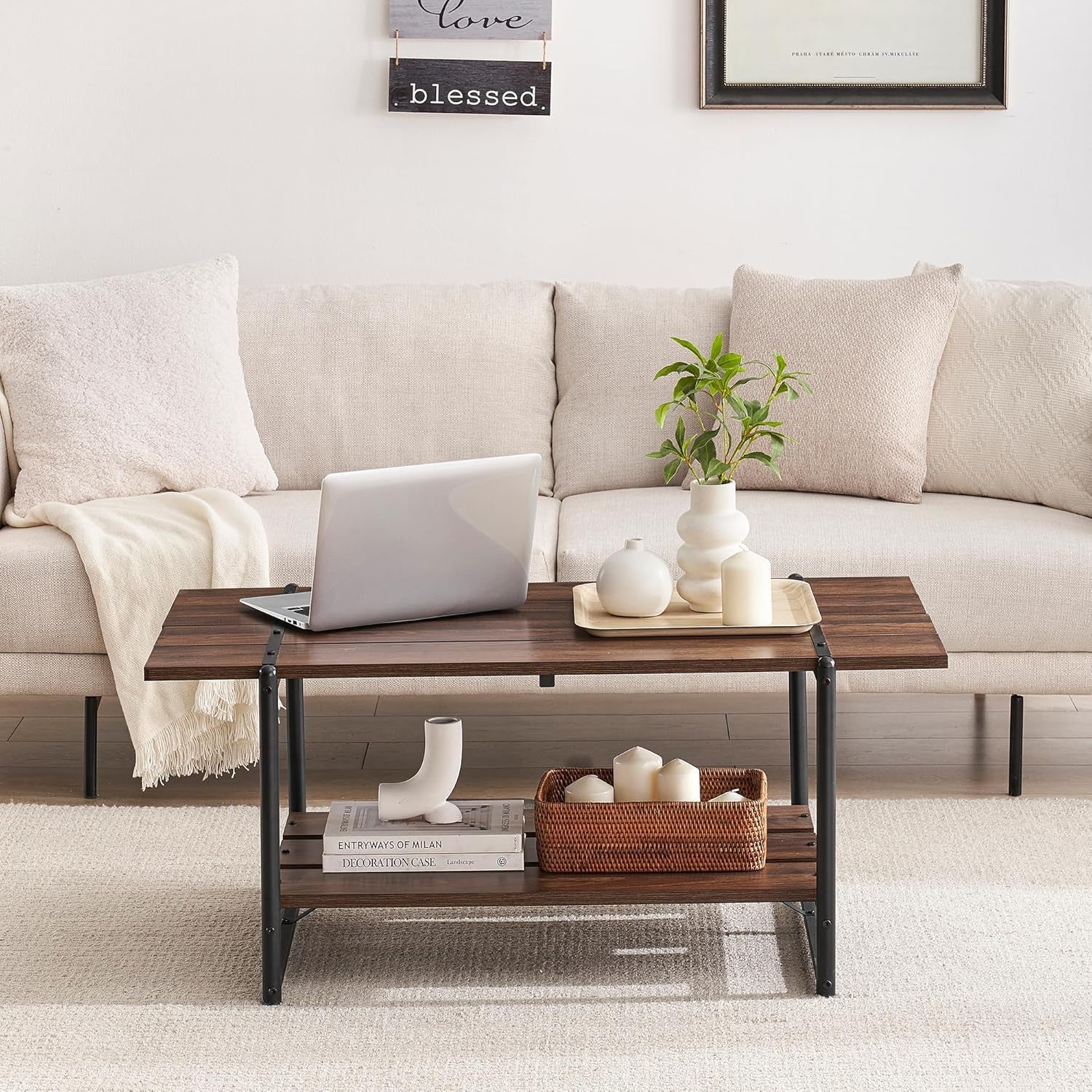 Living room with a beige sofa, wooden coffee table, and decorative items.