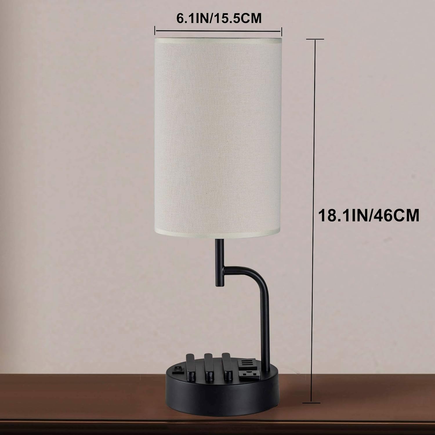 Table lamp with dimensions indicated on a plain background