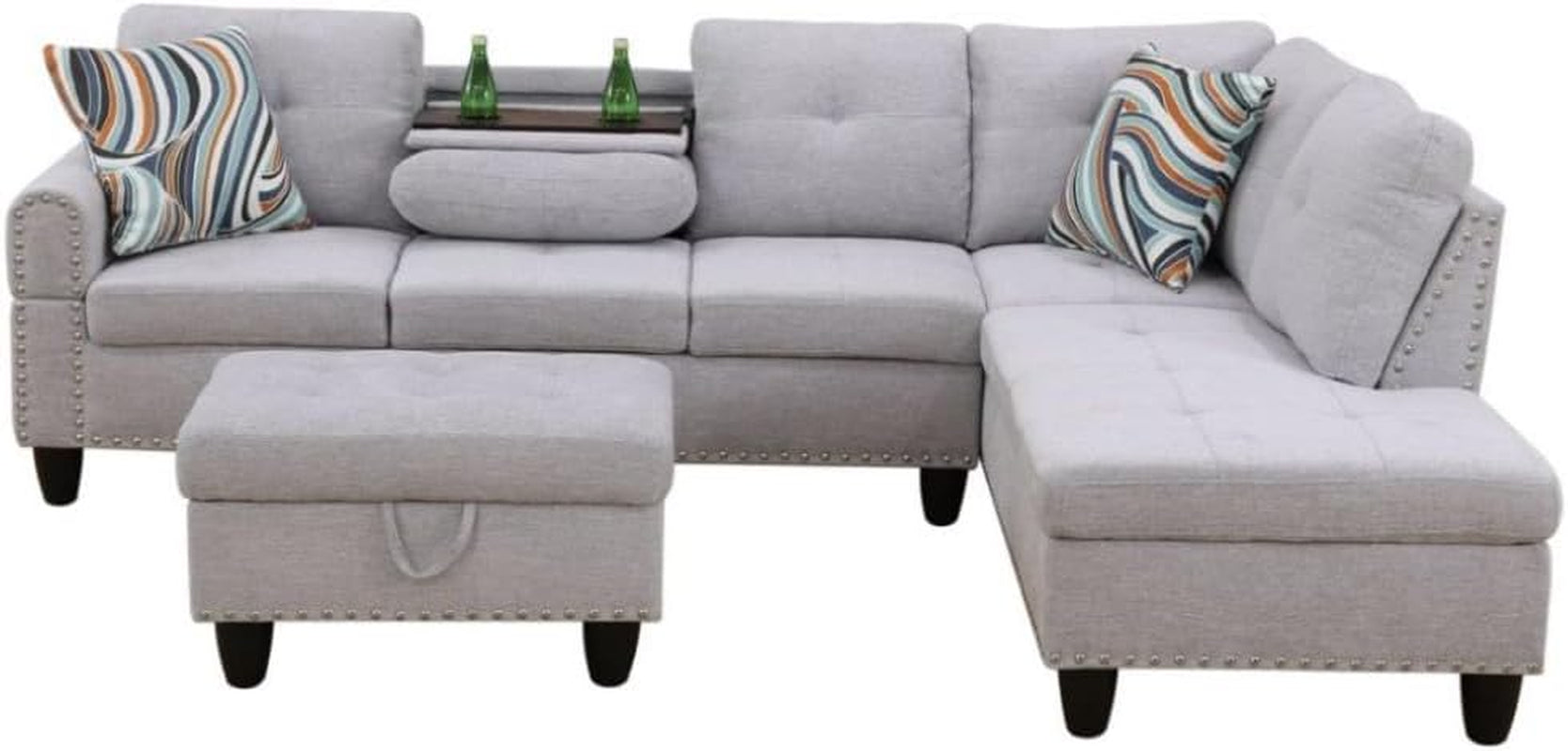 Gray sectional sofa with patterned cushions on a white background