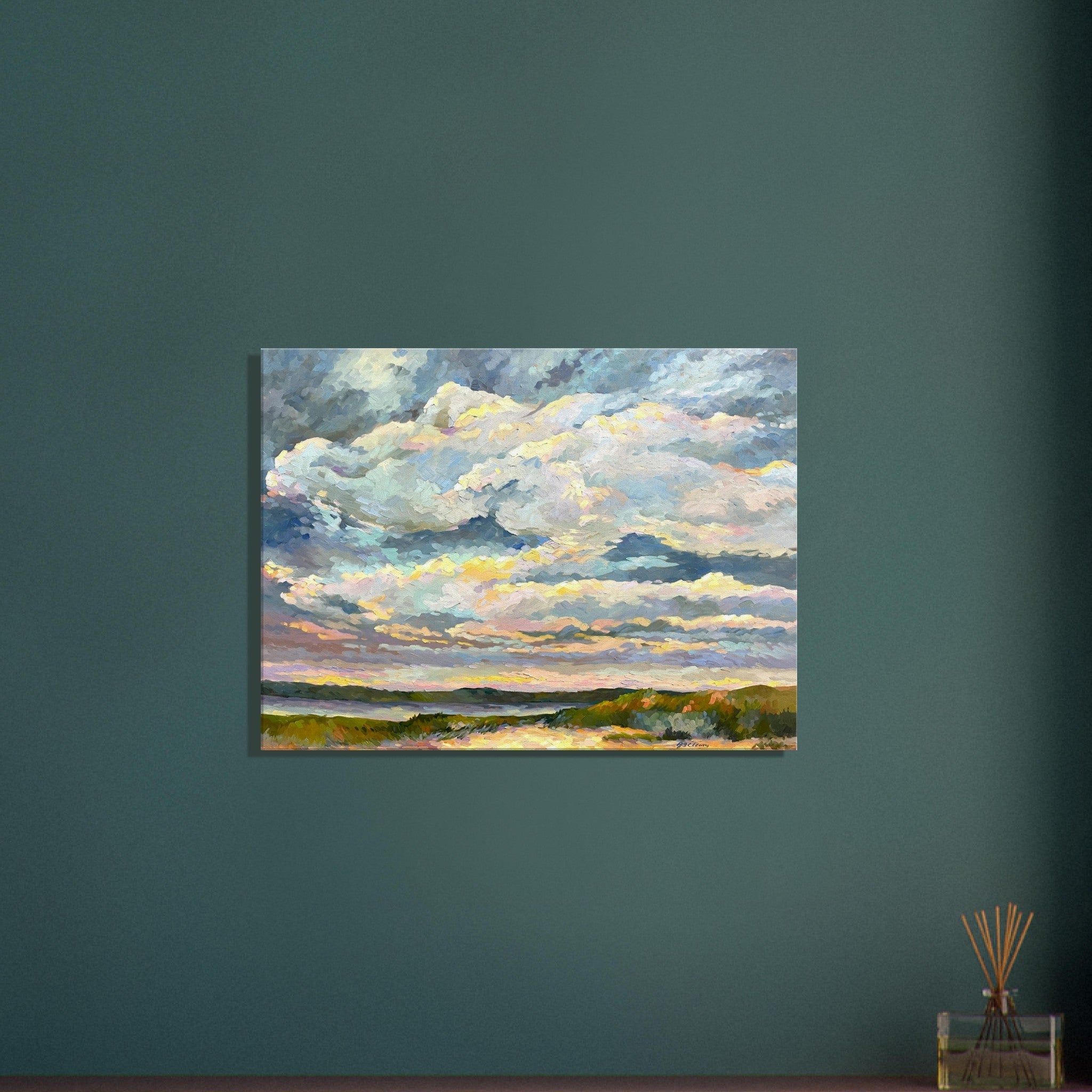 Painting of a landscape with clouds on a teal wall