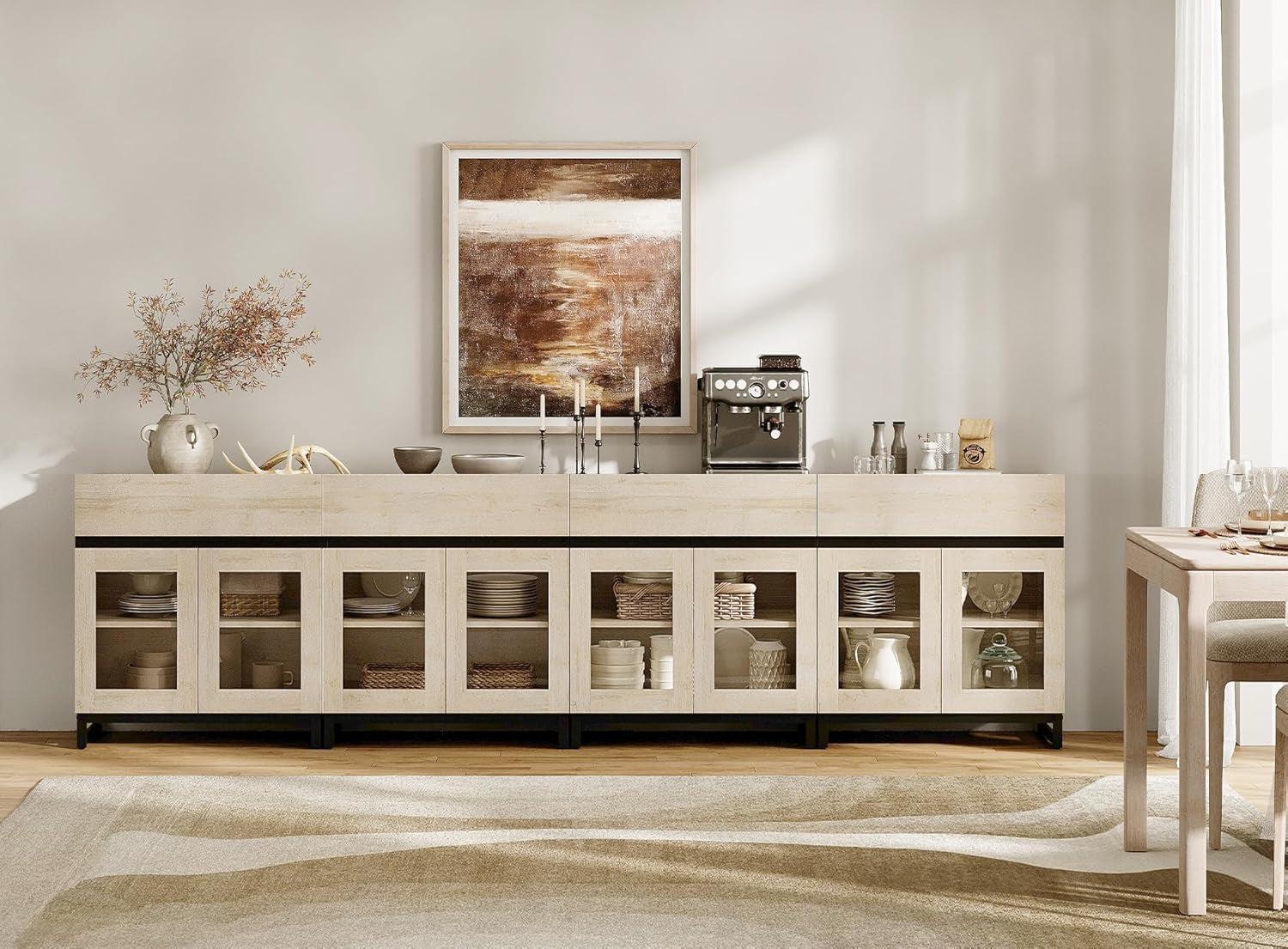 Modern kitchen with a long wooden cabinet, coffee machine, and decor items.