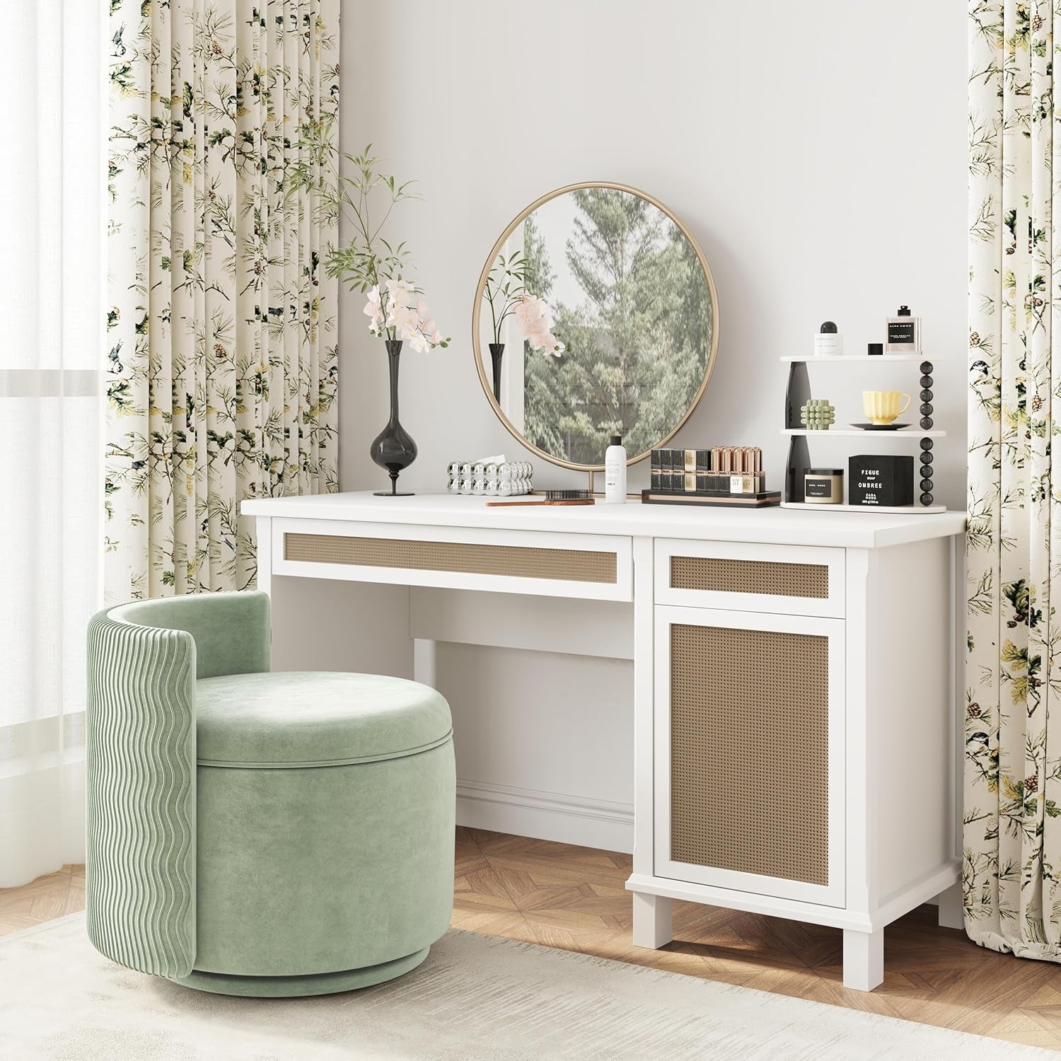 White vanity desk with round mirror and green chair in a room with floral curtains.