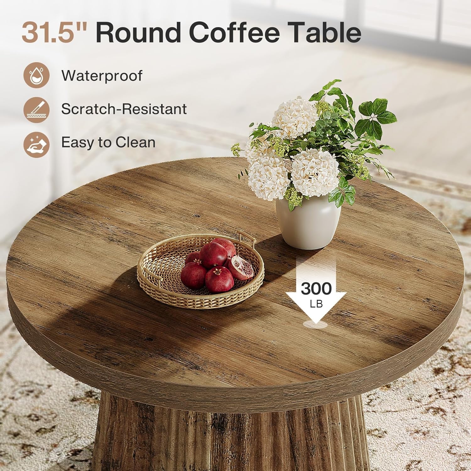 Round wooden coffee table with a decorative arrangement on a light-colored floor.
