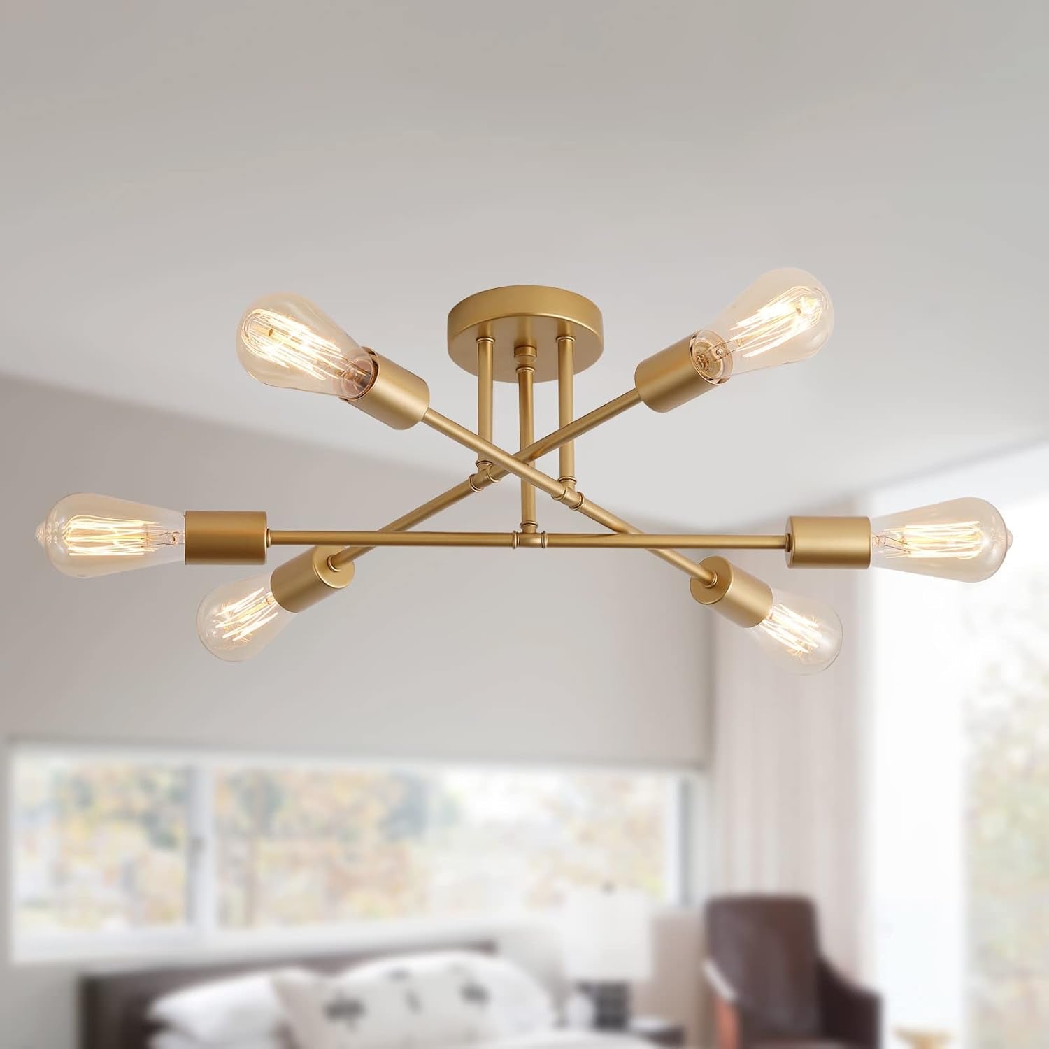 Gold ceiling light fixture with multiple bulbs in a modern living room setting.