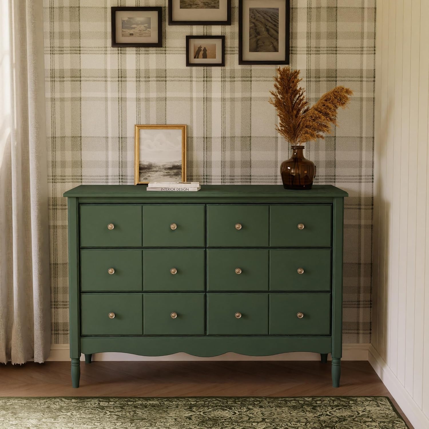 Green dresser with decorative items against a plaid wall.
