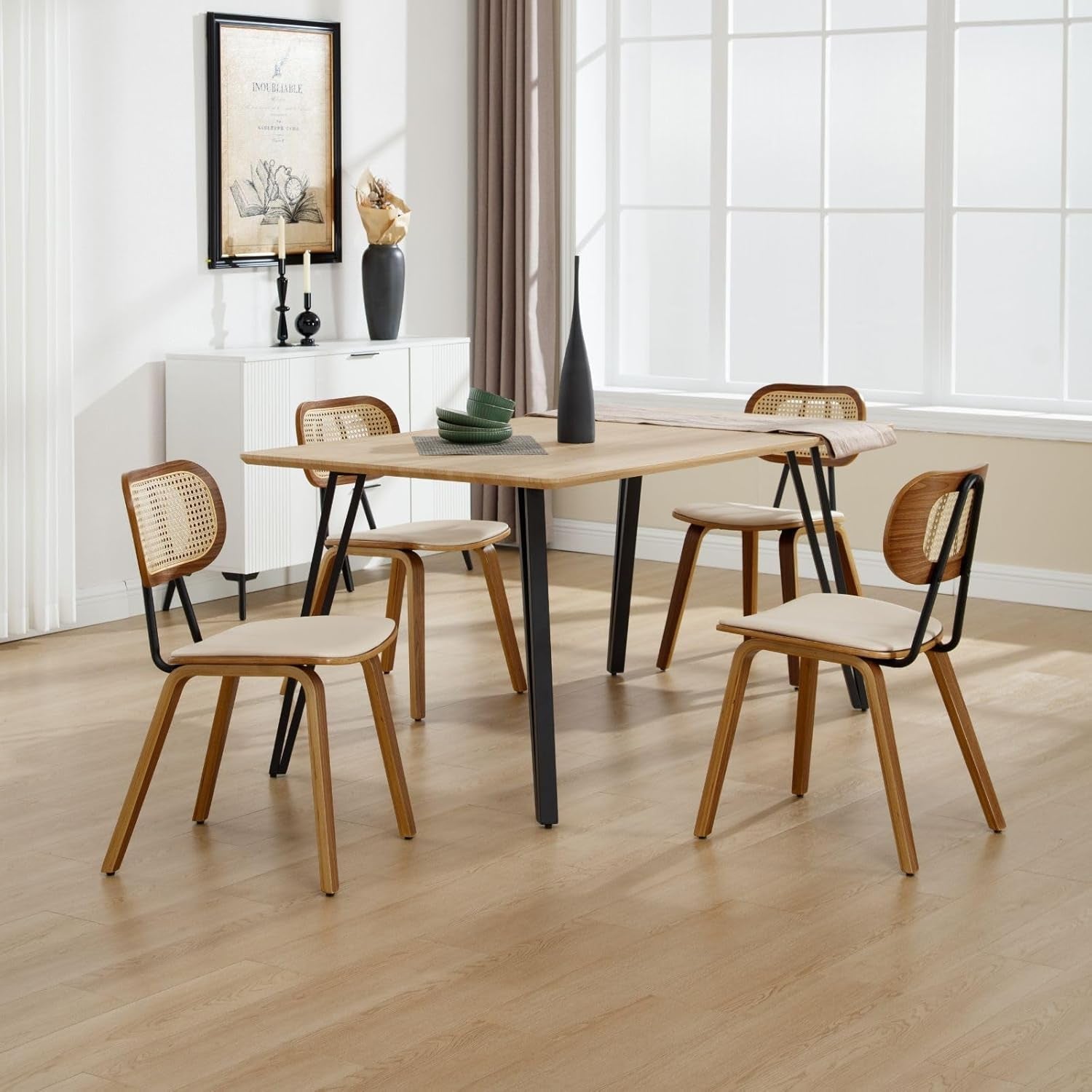 Dining table with wooden chairs in a bright room