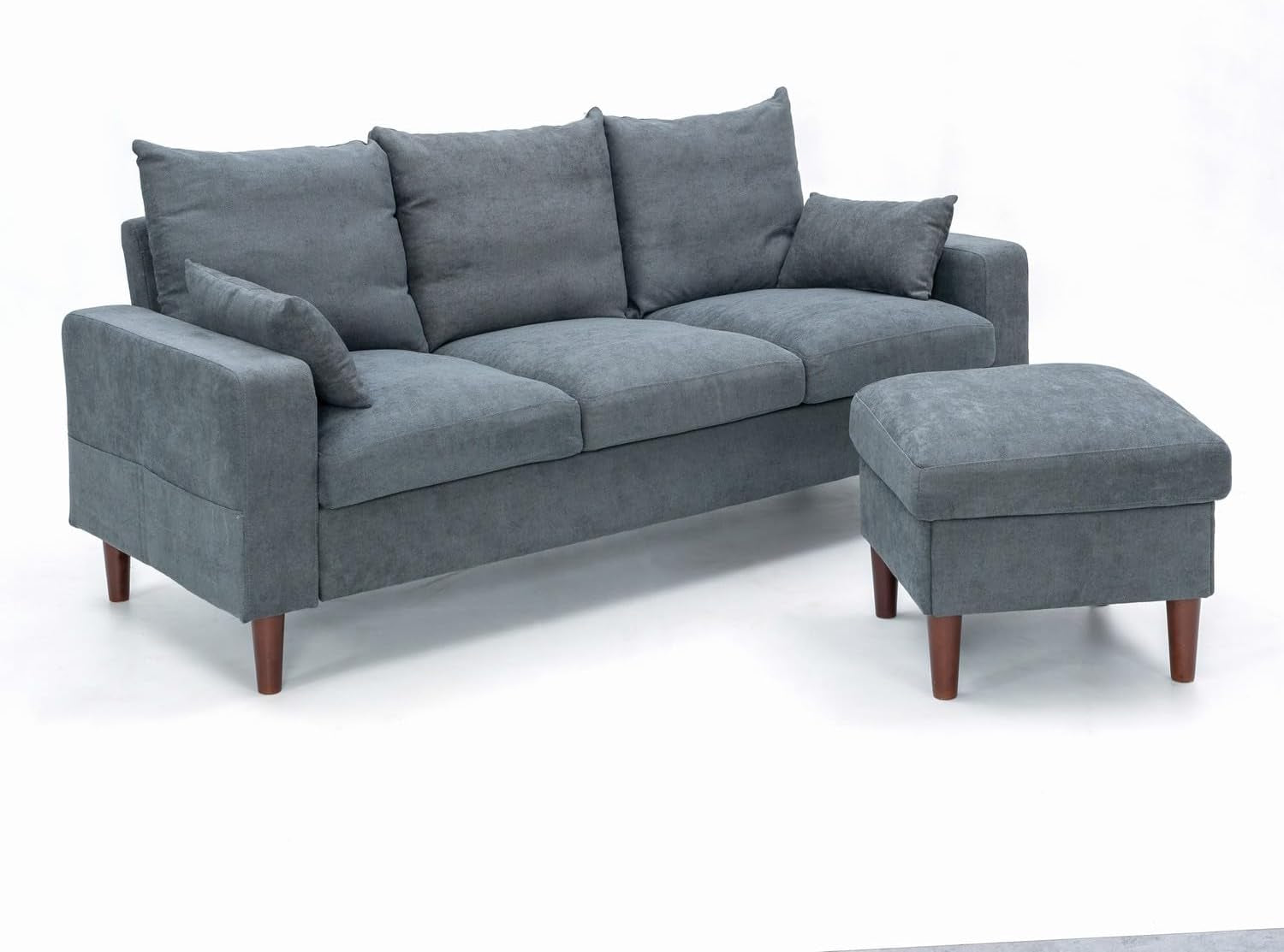Gray sofa with matching ottoman on a white background