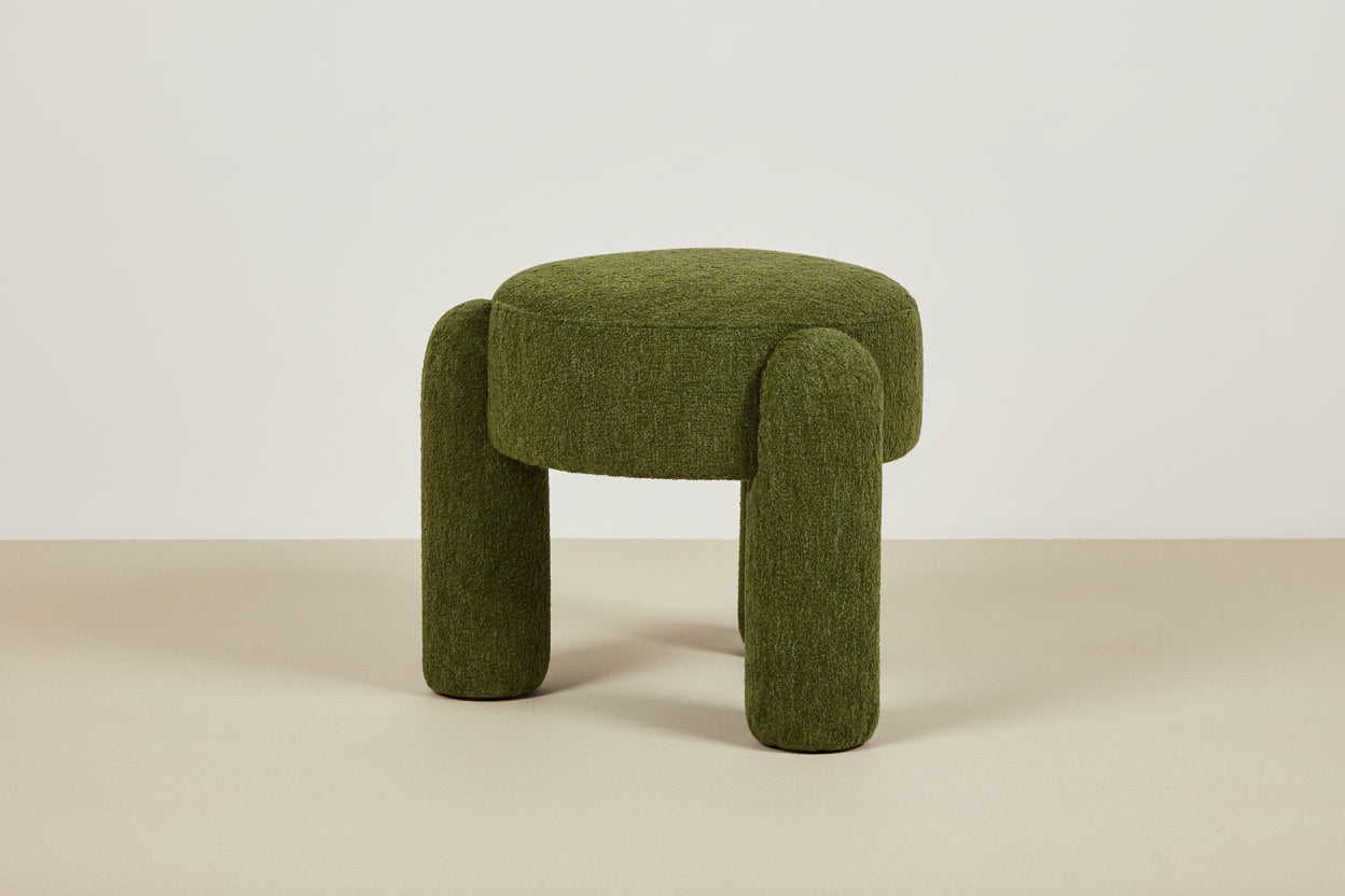 Green textured stool on a white background