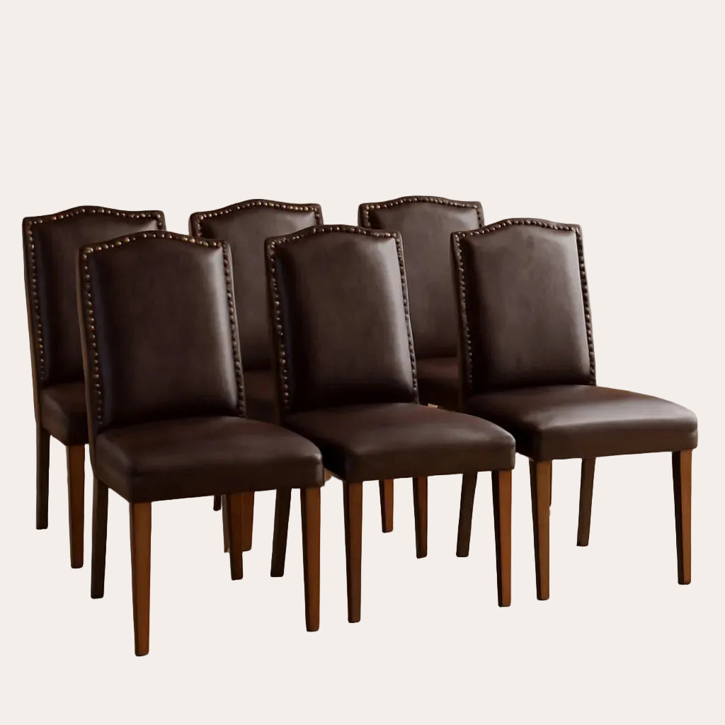 Set of six brown leather chairs with wooden legs on a beige rug.
