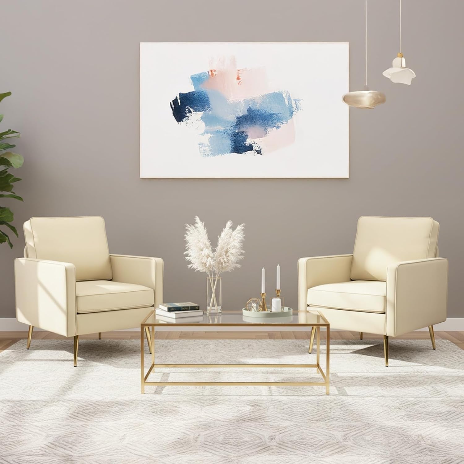 Modern living room with beige armchairs, a glass coffee table, and abstract art on the wall.