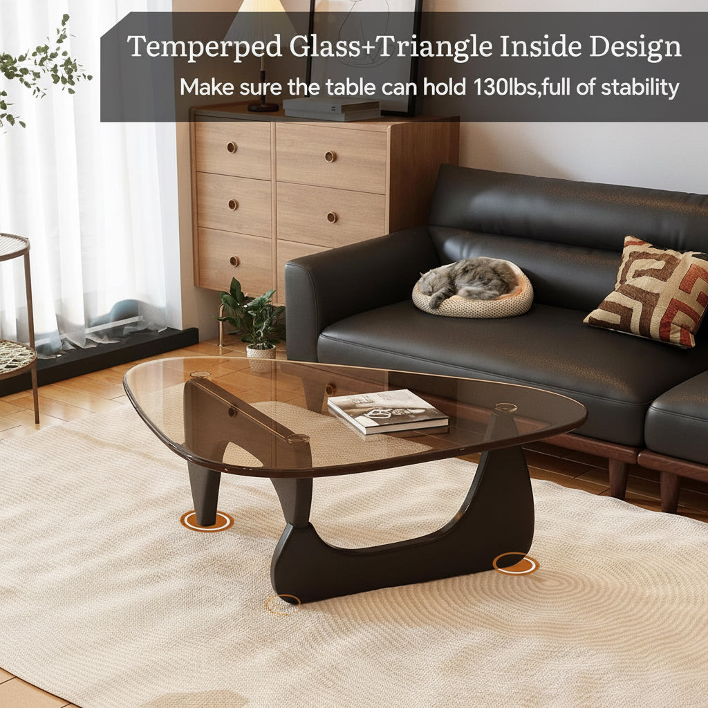Woman sitting on a modern glass coffee table in a living room.