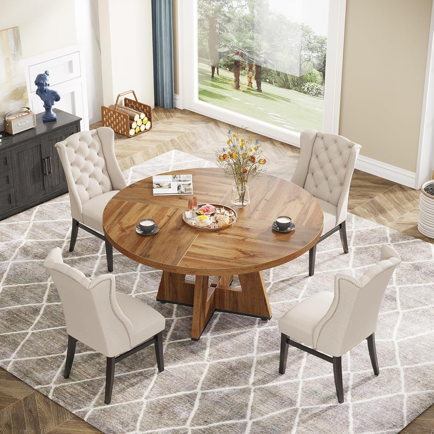 Dining room with a wooden table and four chairs on a patterned rug.