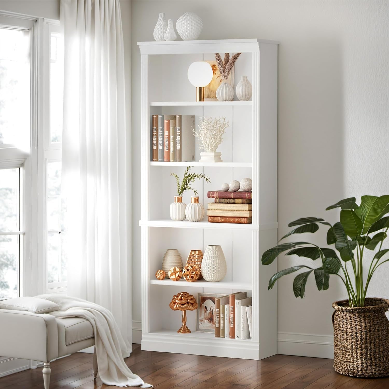 White bookshelf with decorative items in a room with a window and plant