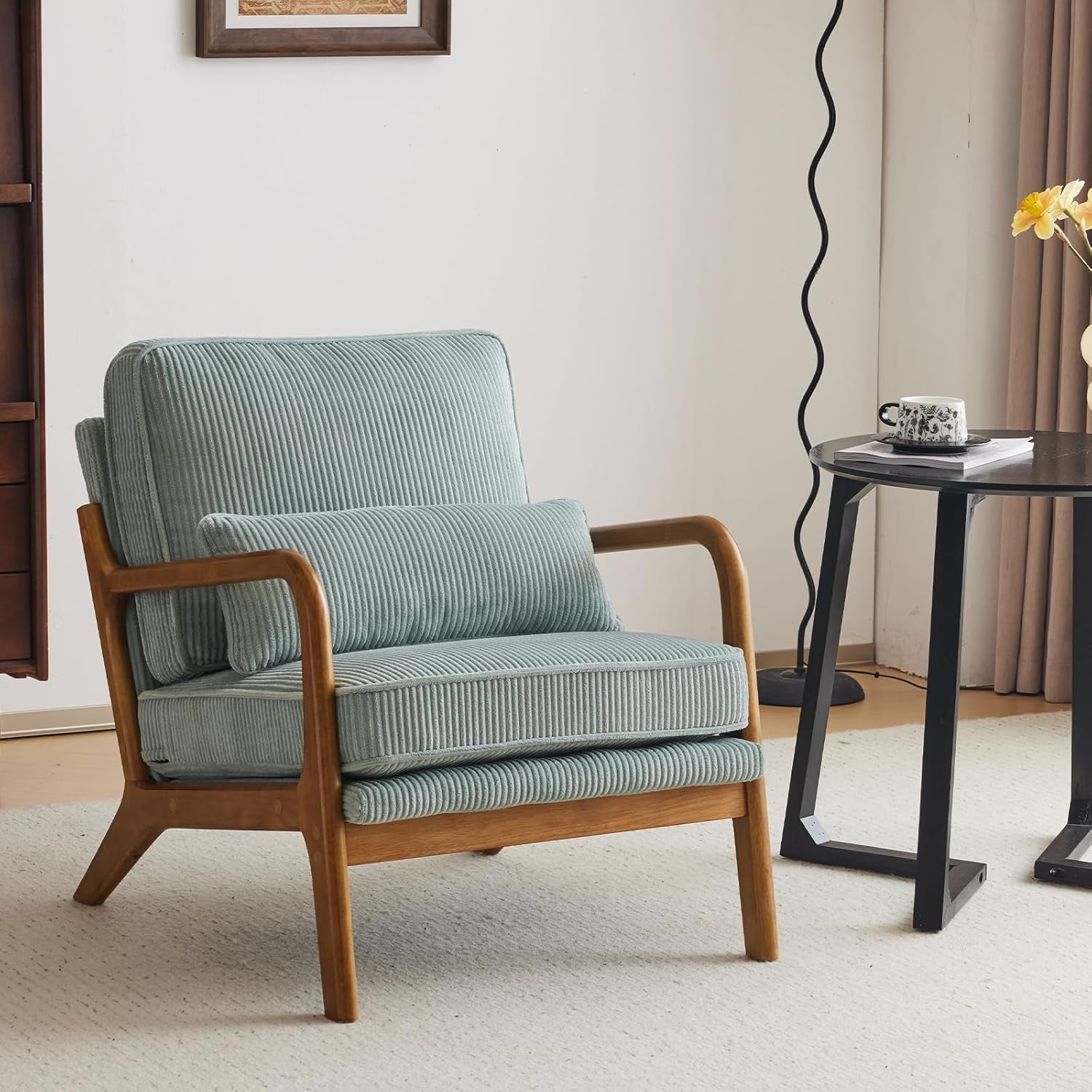 Light blue armchair with wooden frame in a room setting